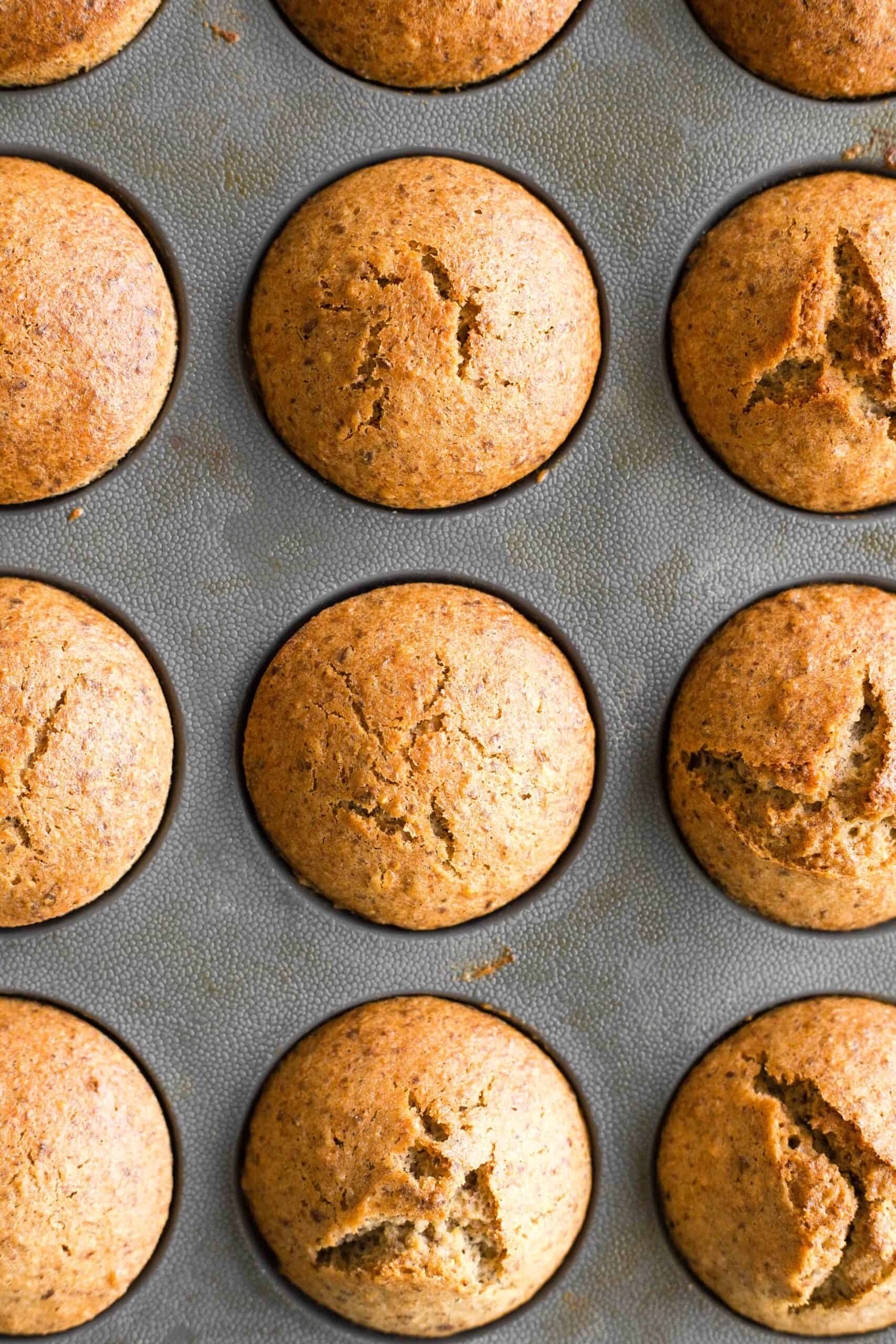 Freshly baked flaxseed muffins in a silicon muffin mold. 