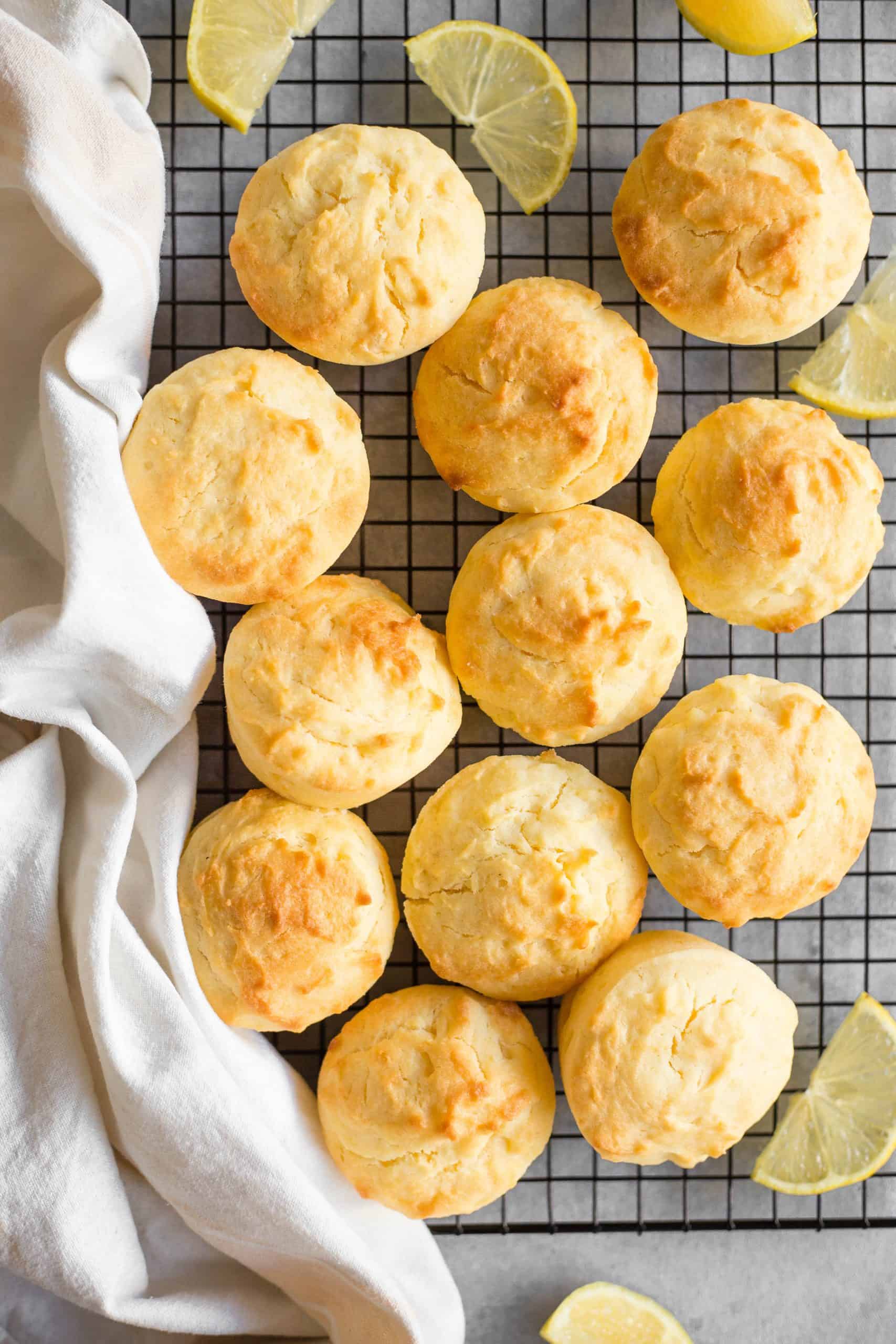 Gluten-free lemon muffins cooling on a wire rack.