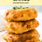 A stack of potato cakes topped with chopped fresh herbs.