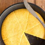 Sliced cornbread in cast iron skillet