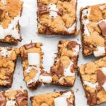 Top down view of S'mores cookie bars on parchment paper.