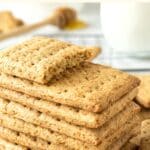 A stack of graham crackers on wire rack.