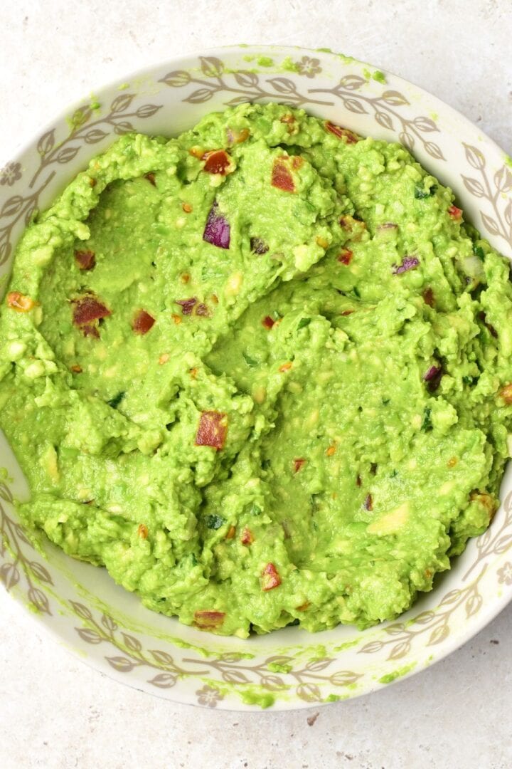 A bowl of homemade guacamole dip