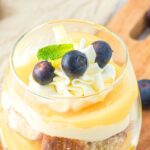 Lemon cheesecake cup on wooden board.