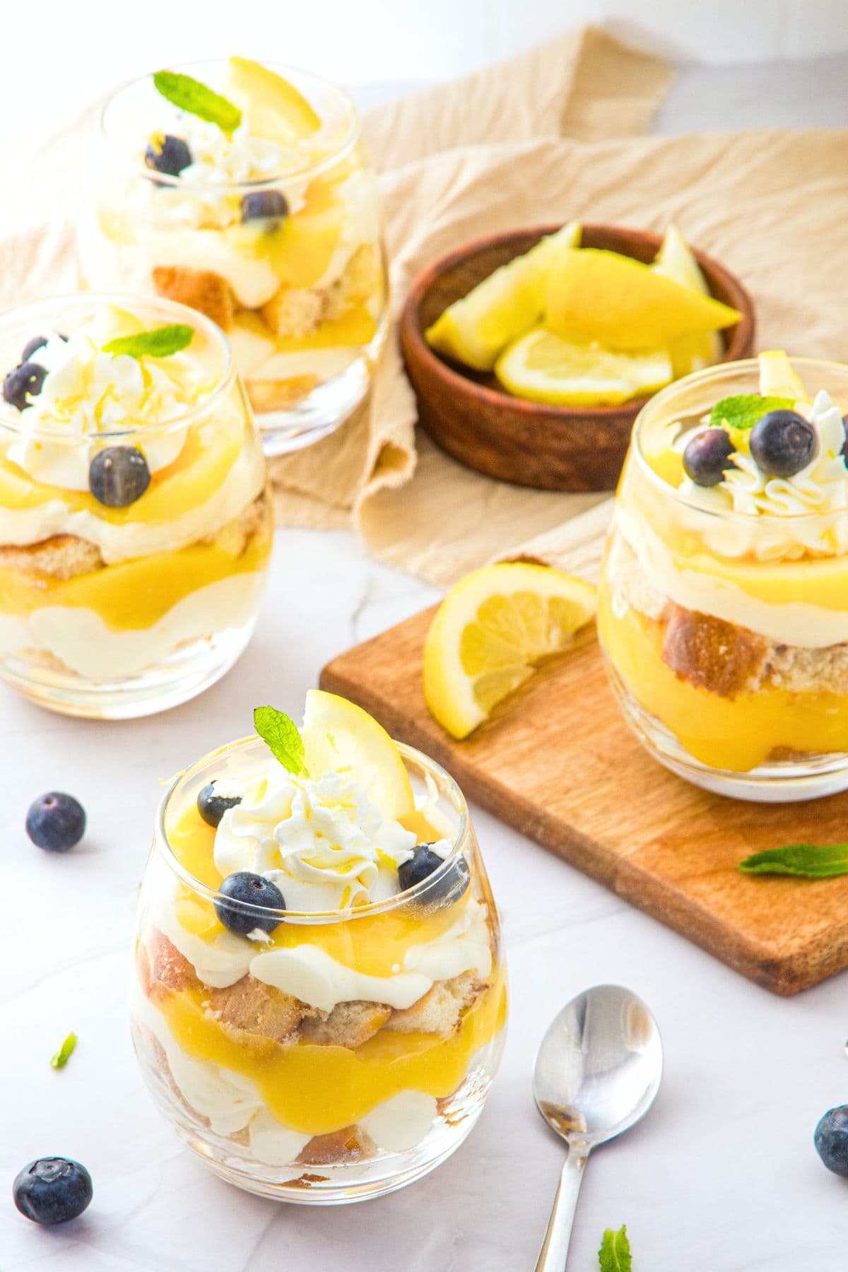Gluten-free lemon dessert cups topped with whipped cream