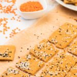 Homemade lentil crackers on parchment paper