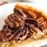 A slice of pecan pie on a plate