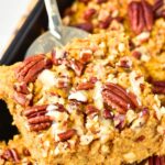 Holding up a slice of baked pumpkin oatmeal