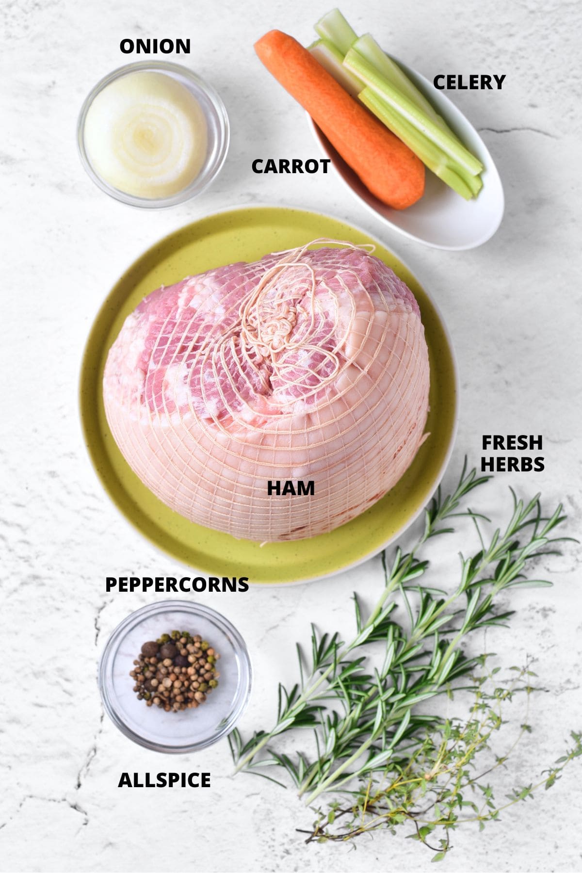 Ingredients for slow cooker ham recipe on marble board