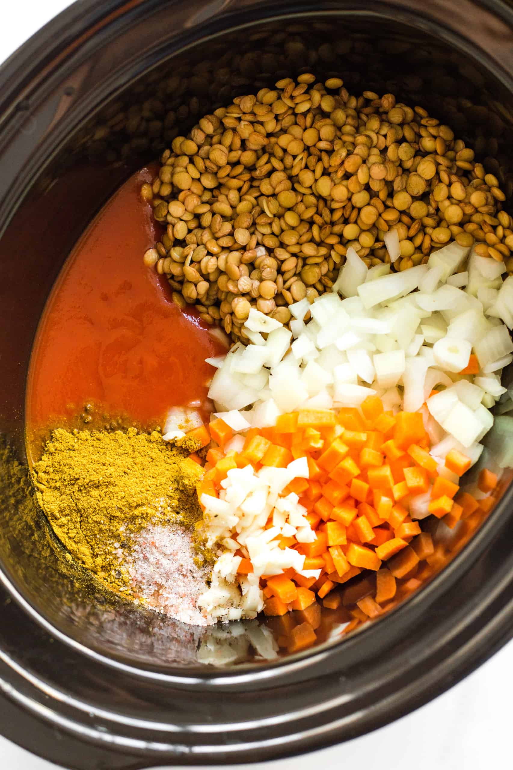 Lentil curry ingredients ready to cook in the slow cooker