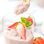 Holding up a spoonful of strawberry chia pudding.