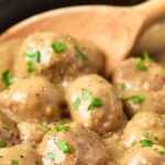 Mixing Swedish meatballs in a cast iron skillet