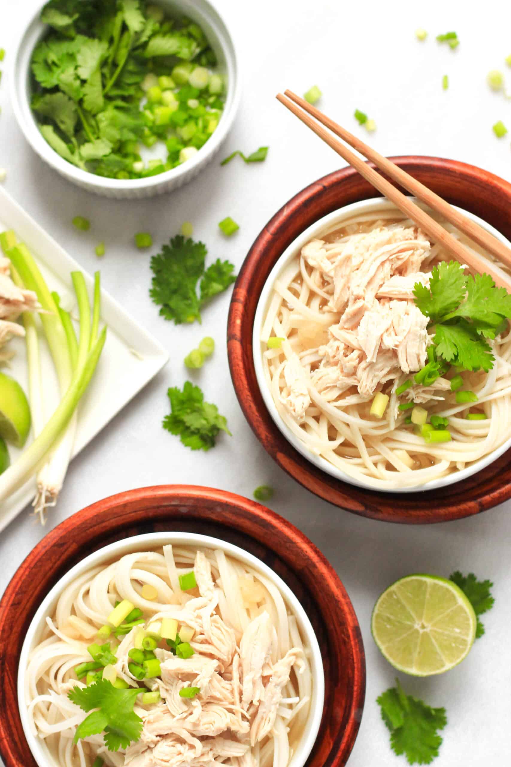 Top down view of bowls of gluten-free pho with chicken.