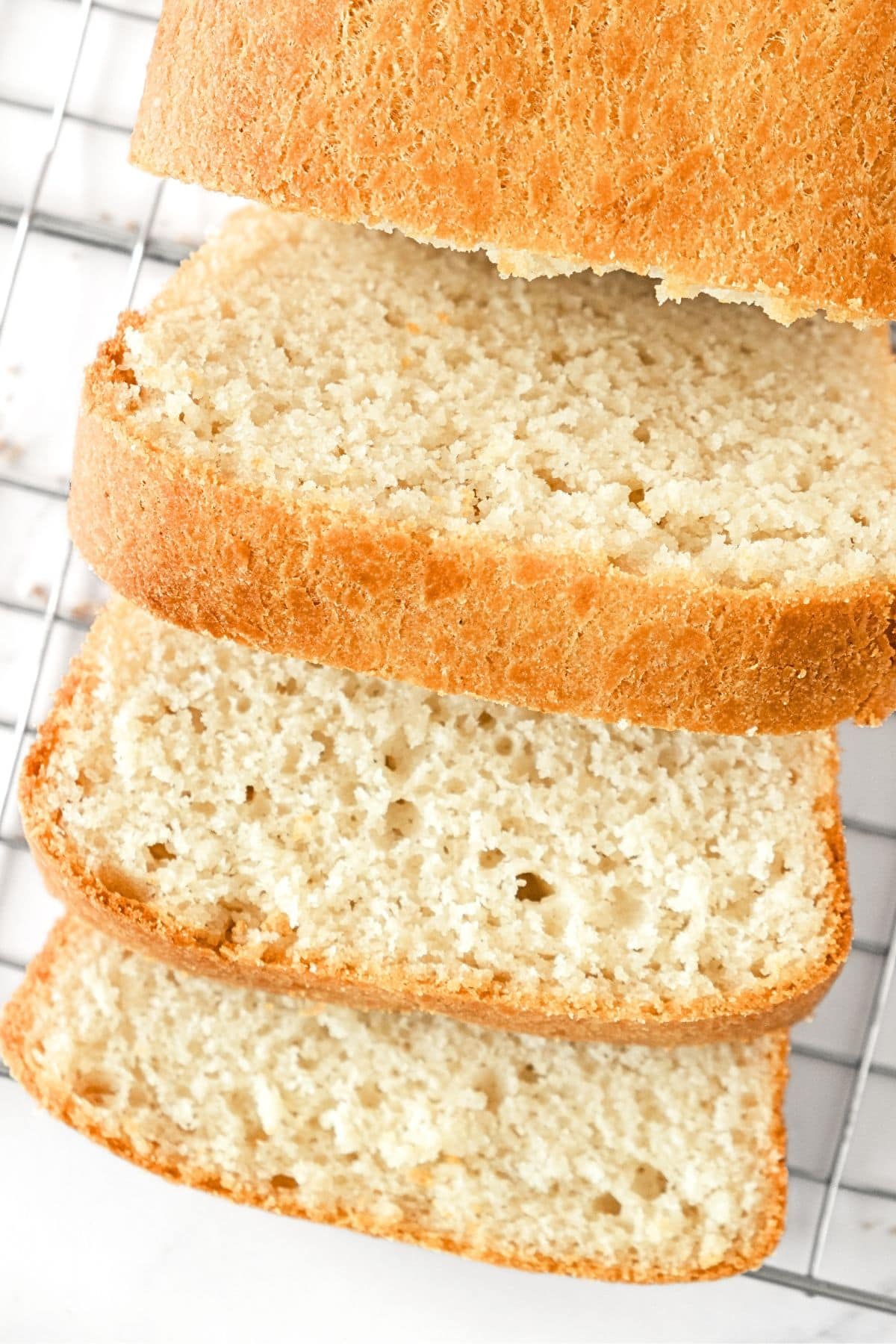 Sliced gluten and egg-free bread on wire rack