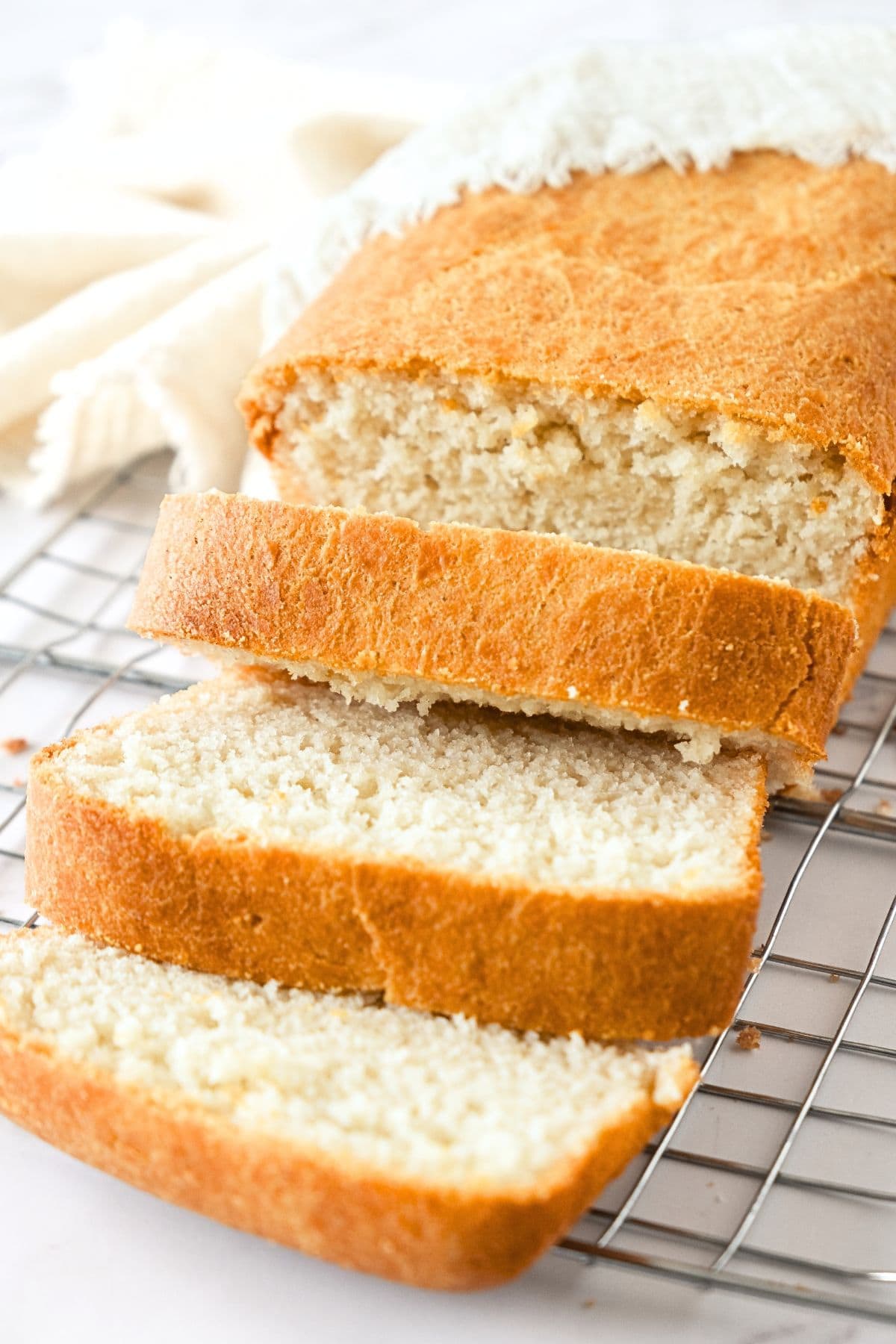 Sliced loaf of gluten-free bread without egg.