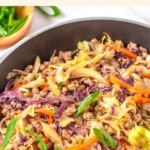 Up close shot of deconstructed egg roll in skillet.