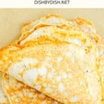 Egg white tortillas on parchment paper.