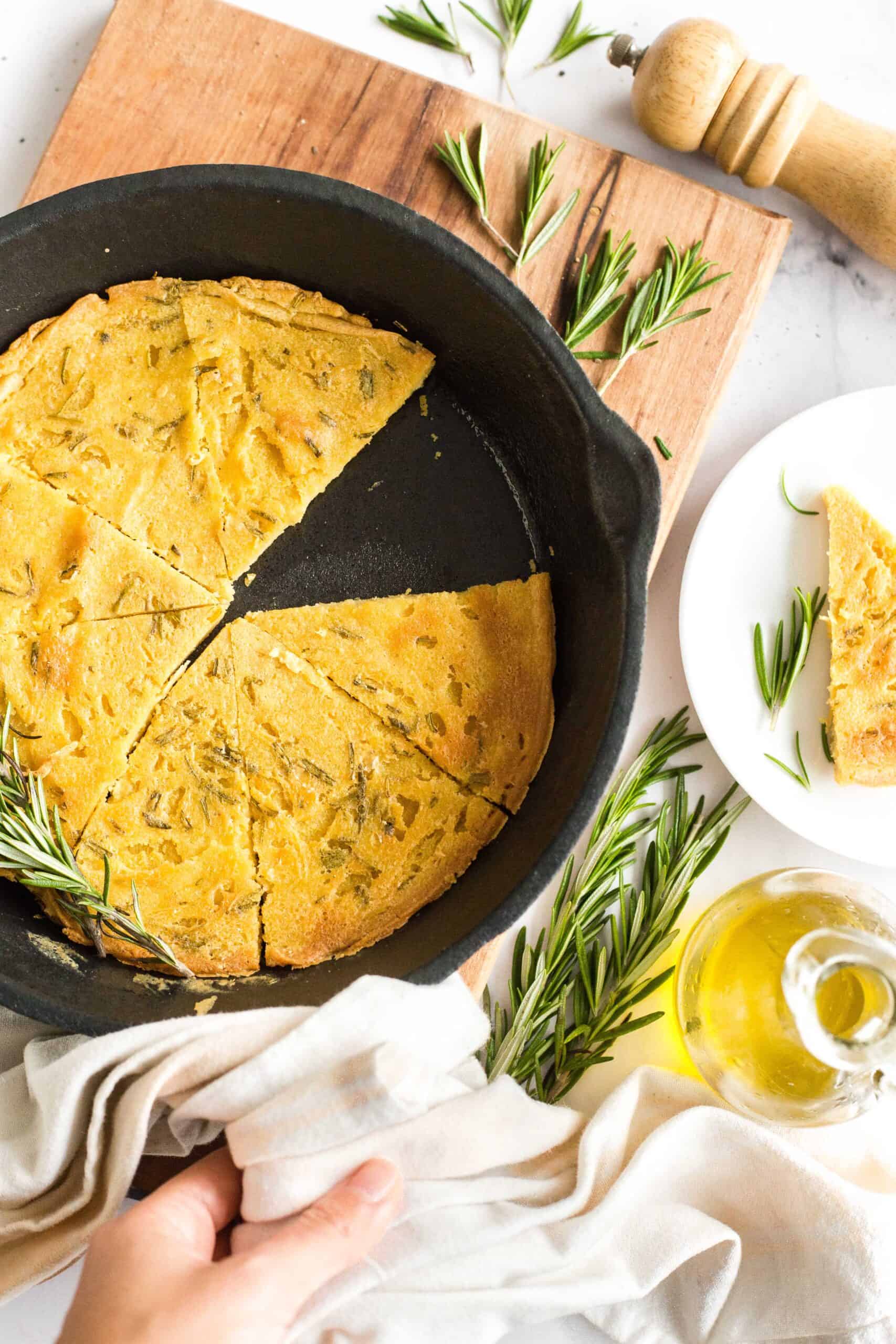 Half-eaten chickpea farinata in skillet.