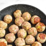 Cooked meatballs in skillet