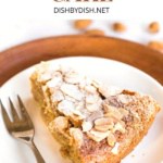 A slice of flourless almond cake on plate.