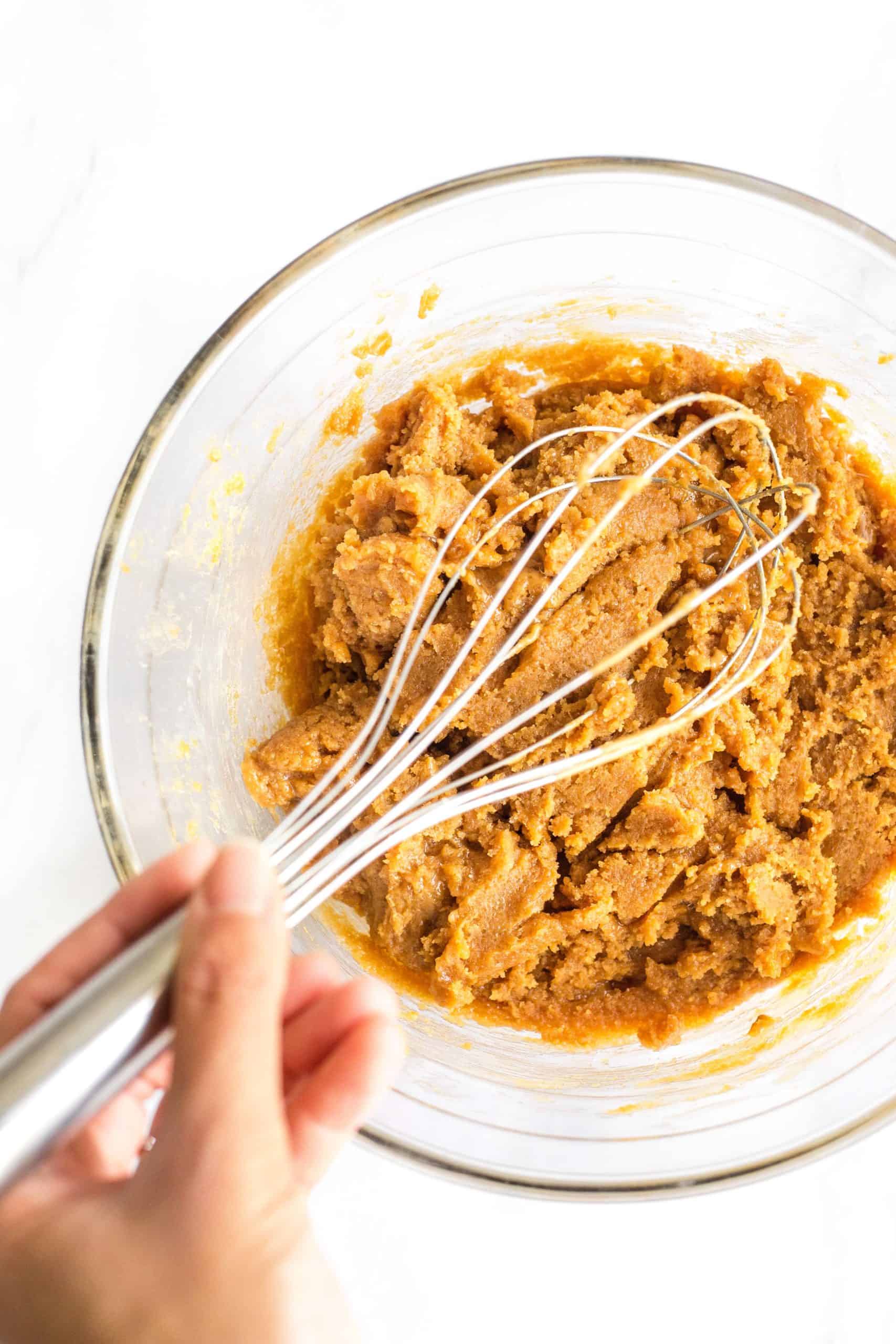Mixing the peanut butter cookie dough in a large bowl.