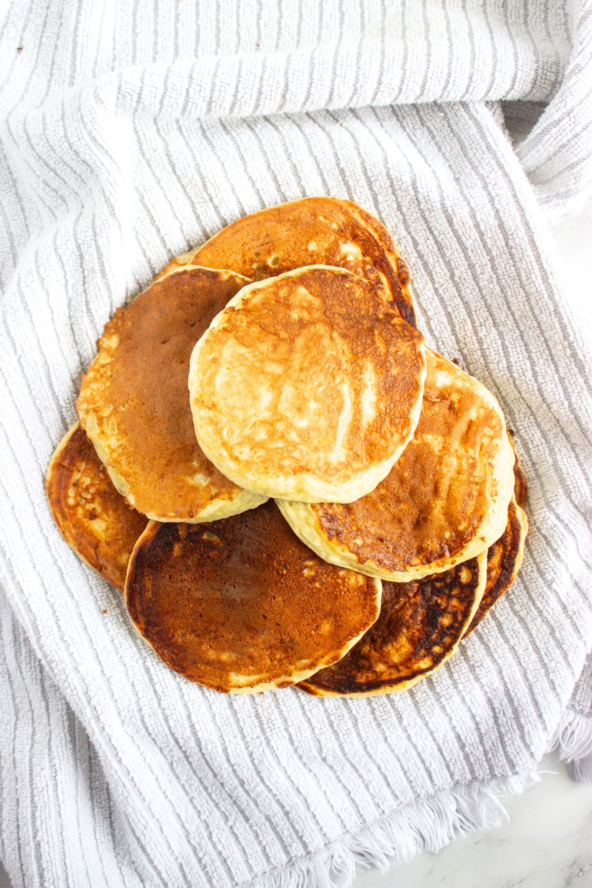 Gluten-free cottage cheese pancakes on kitchen towel