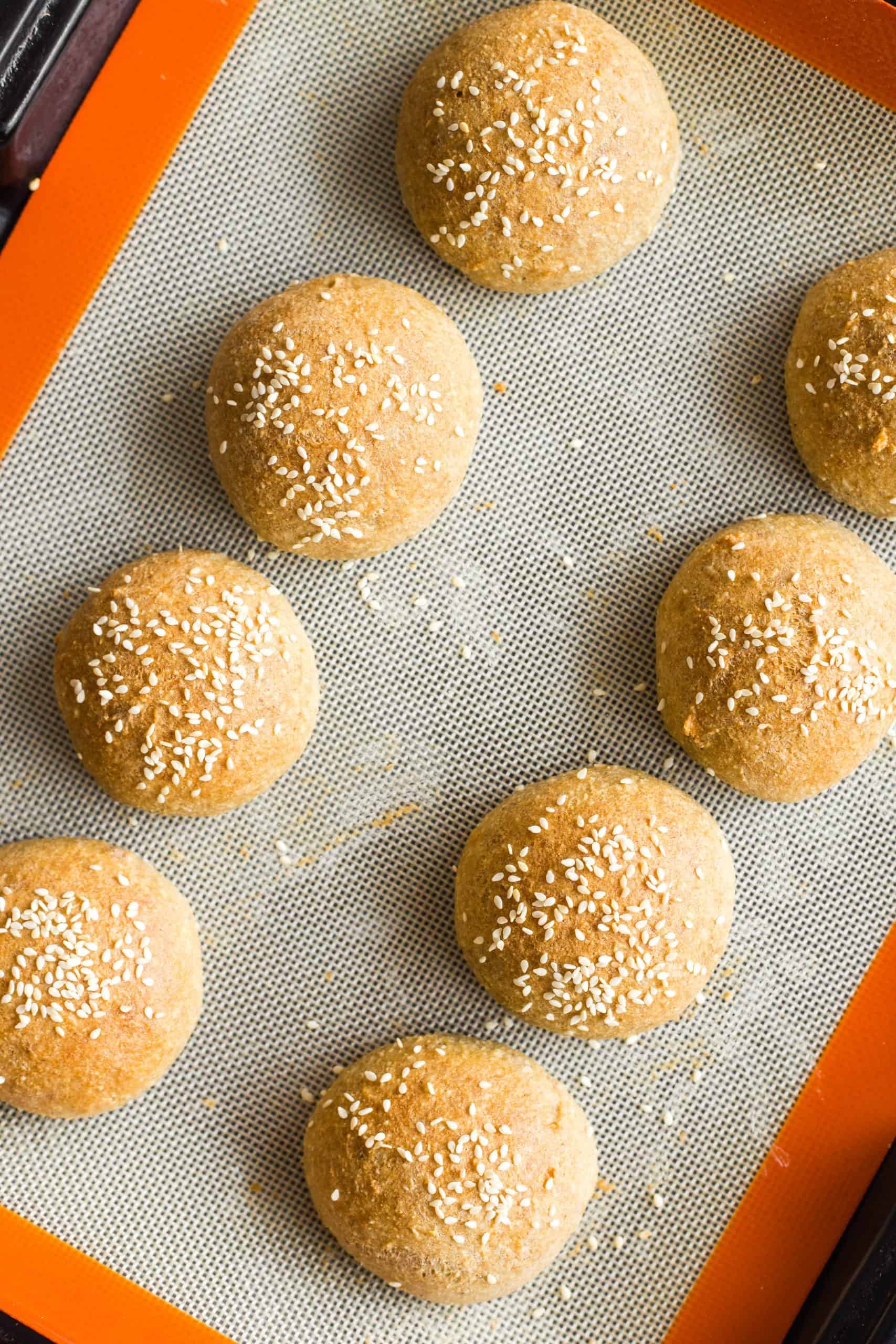 Freshly baked low carb buns on a silpat.