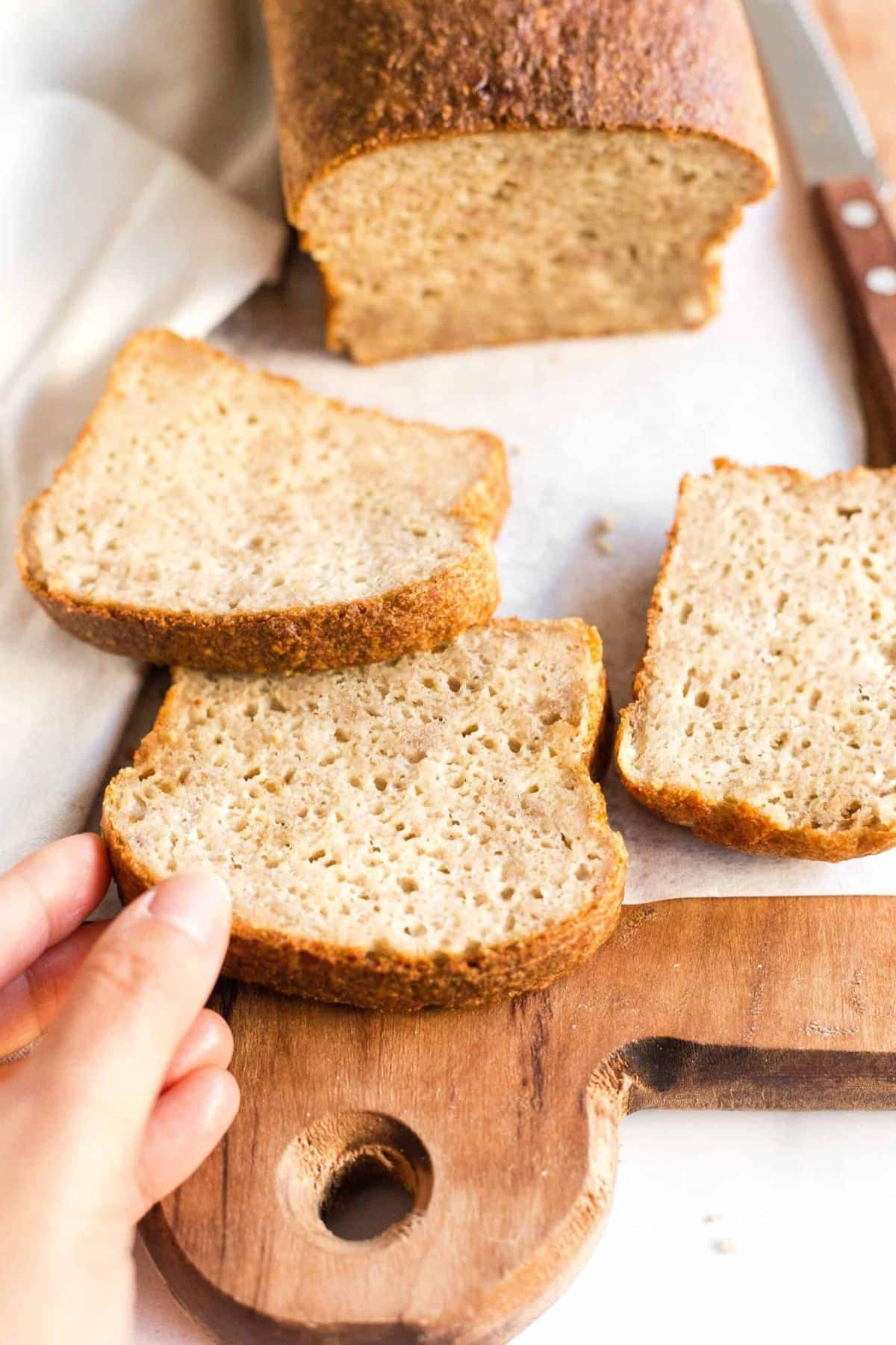 Reaching for a slice of quinoa flour bread.