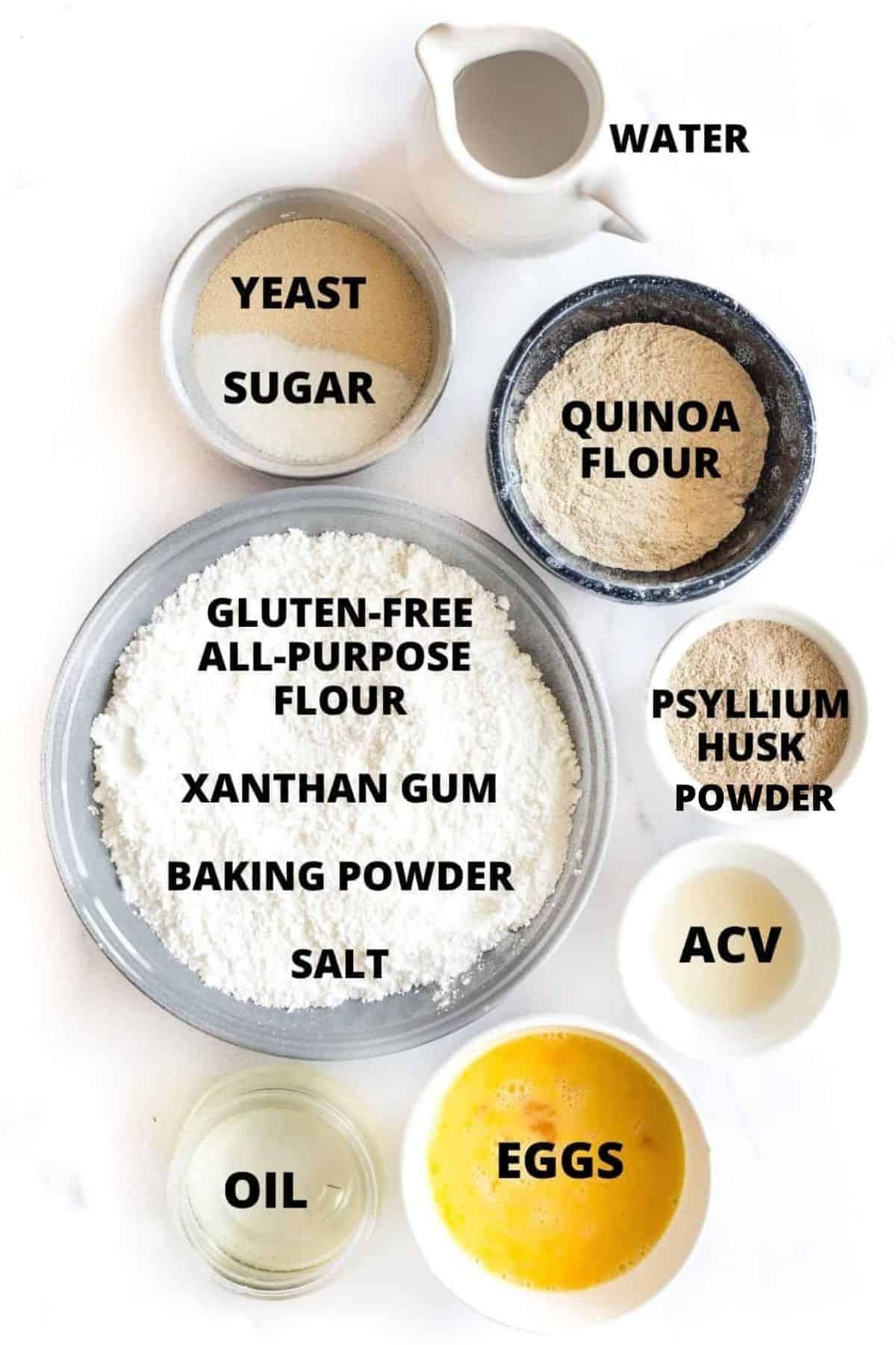 Ingredients for gluten-free quinoa bread recipe laid out on a white board.