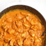 Top down view of tikka masala in skillet.