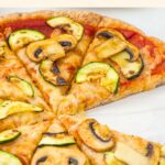 Half-eaten almond flour pizza crust