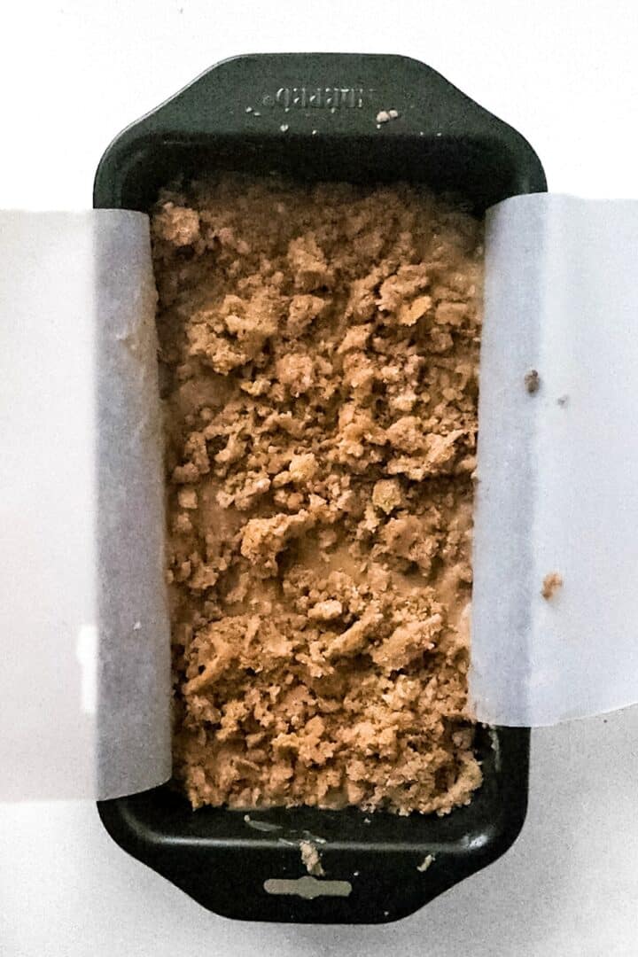 Crumble topping on top of cake batter.