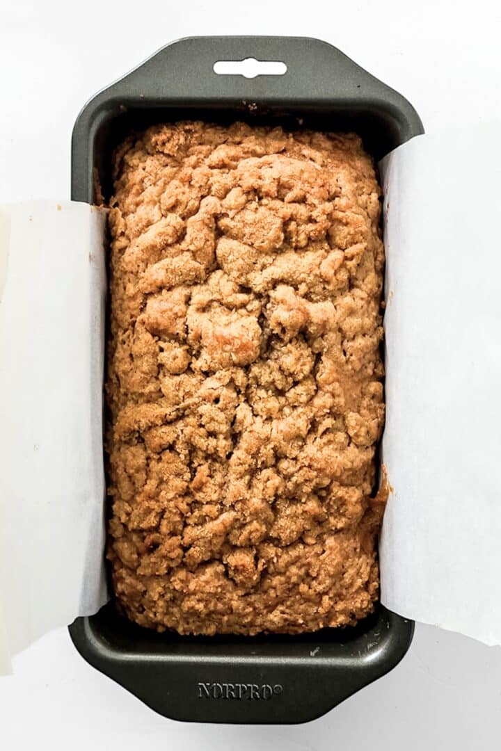Freshly baked gluten-free apple bread with crumble topping.