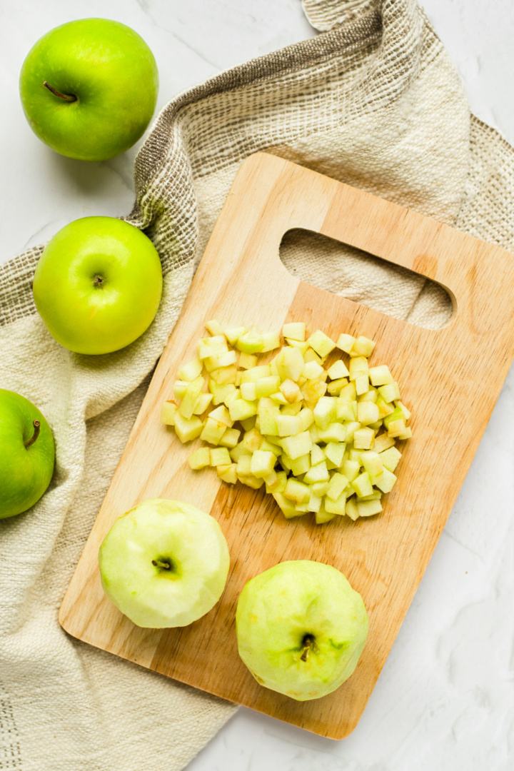 Cubed apples on wooden board