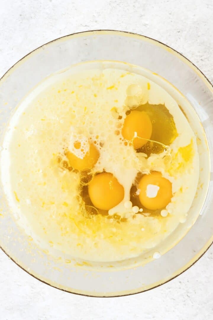 Eggs in a bowl of milk and lemon juice.