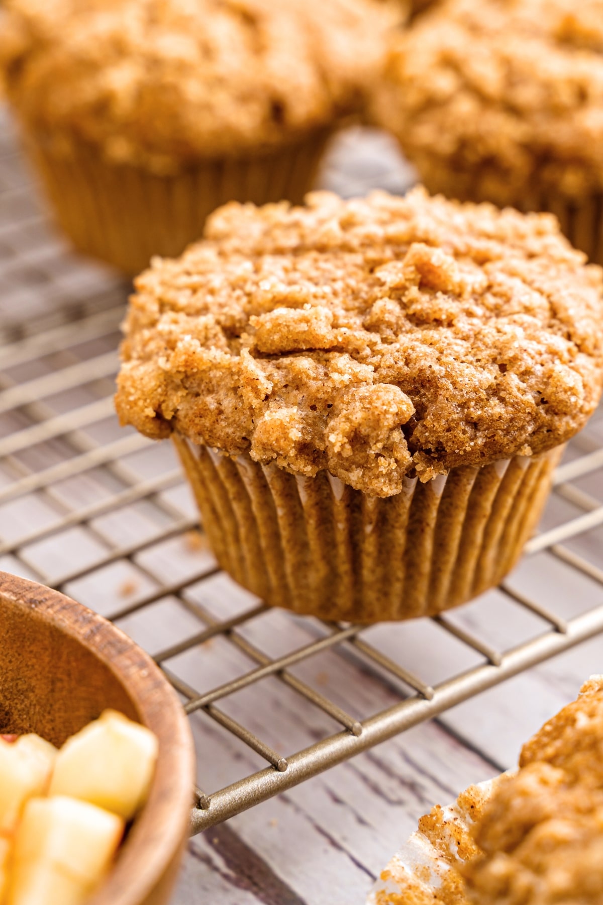 GF applesauce muffins on wire rack.