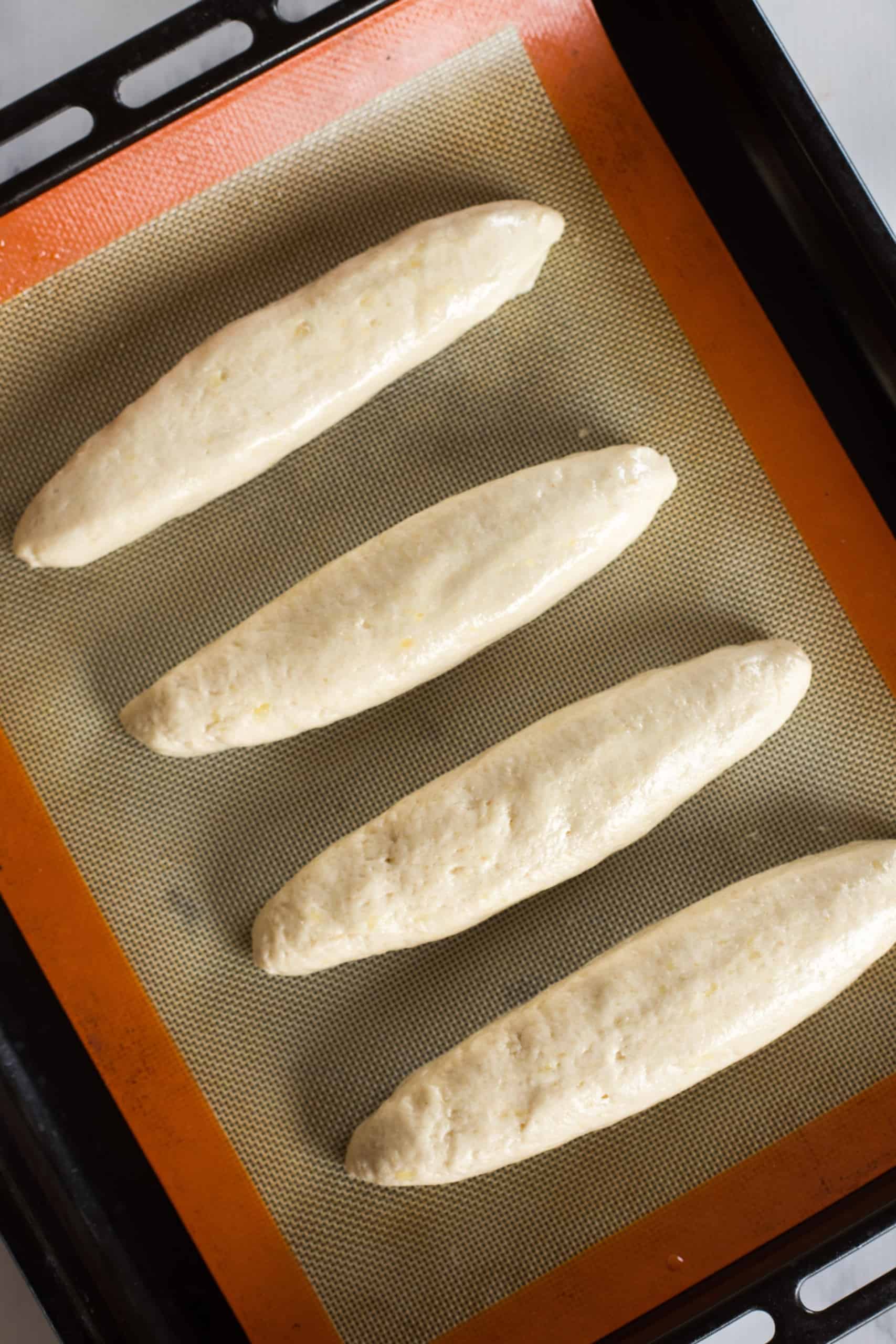 Baguette dough on silpat-lined baking sheet.