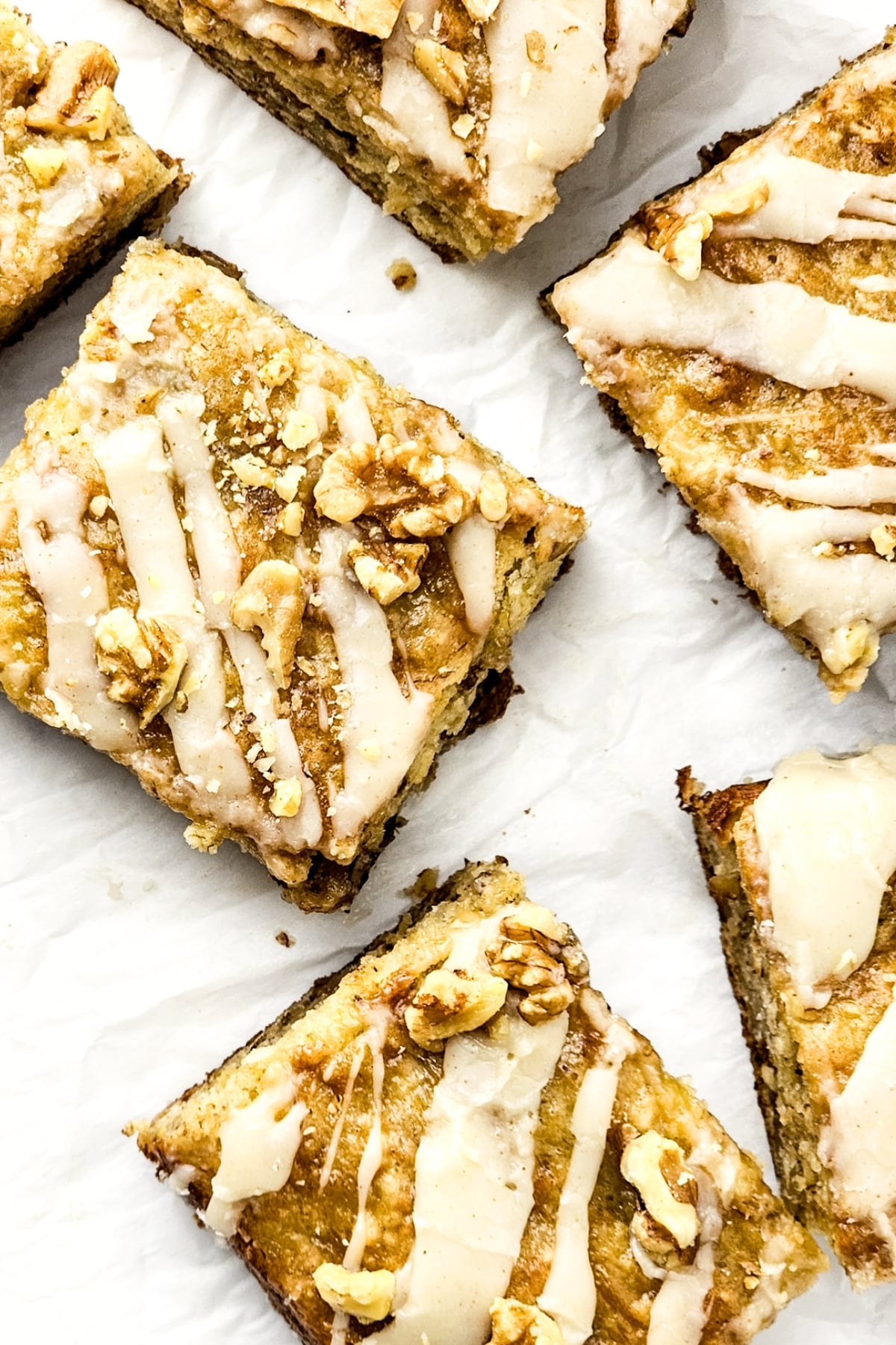 Top down view of gluten-free banana bread bars on parchment.