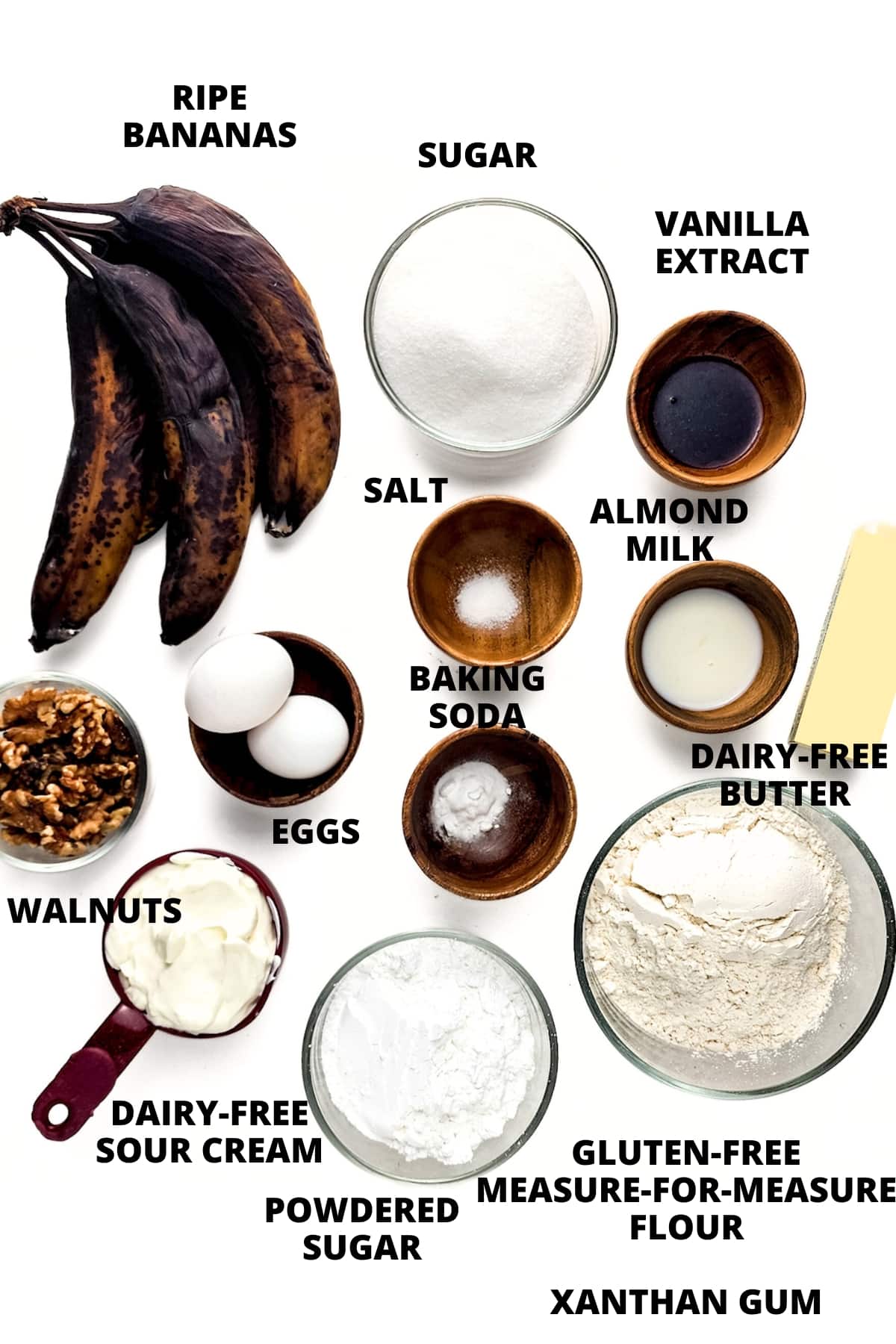 Ingredients for gluten-free banana bars recipe laid out on white board.
