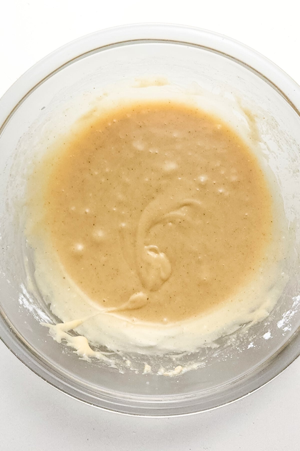 Browned butter glaze in glass bowl.