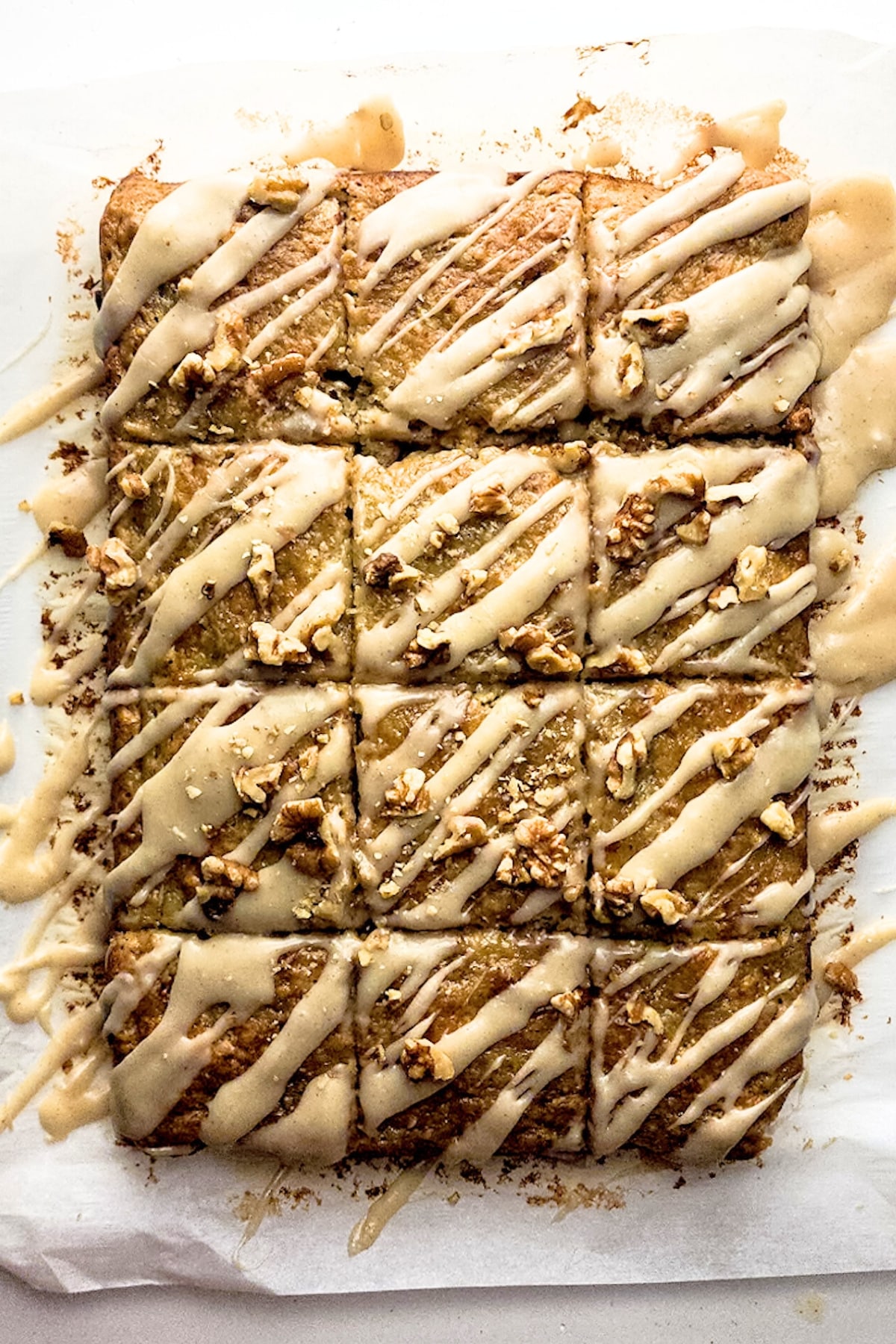 Sliced banana squares drizzled in browned butter glaze.