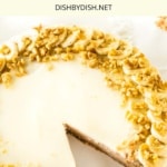 Half-eaten gf banana cake with cream cheese frosting.