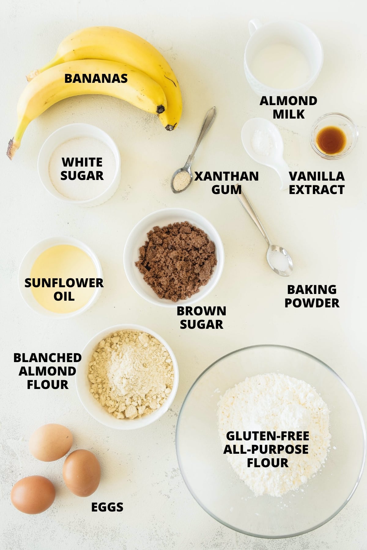 Ingredients for gluten-free banana cake recipe laid out on board.
