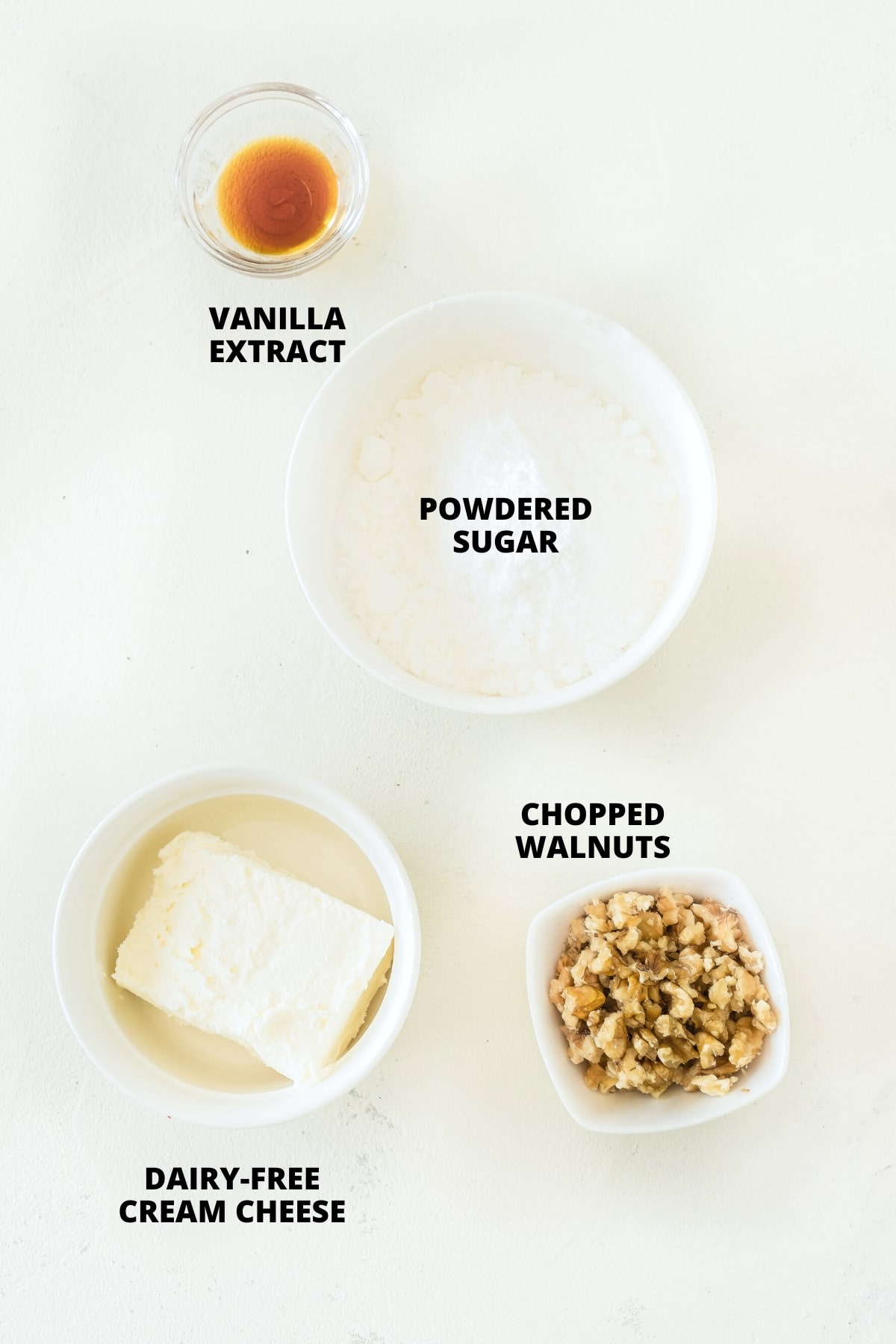 Ingredients for cream cheese frosting laid out on board.
