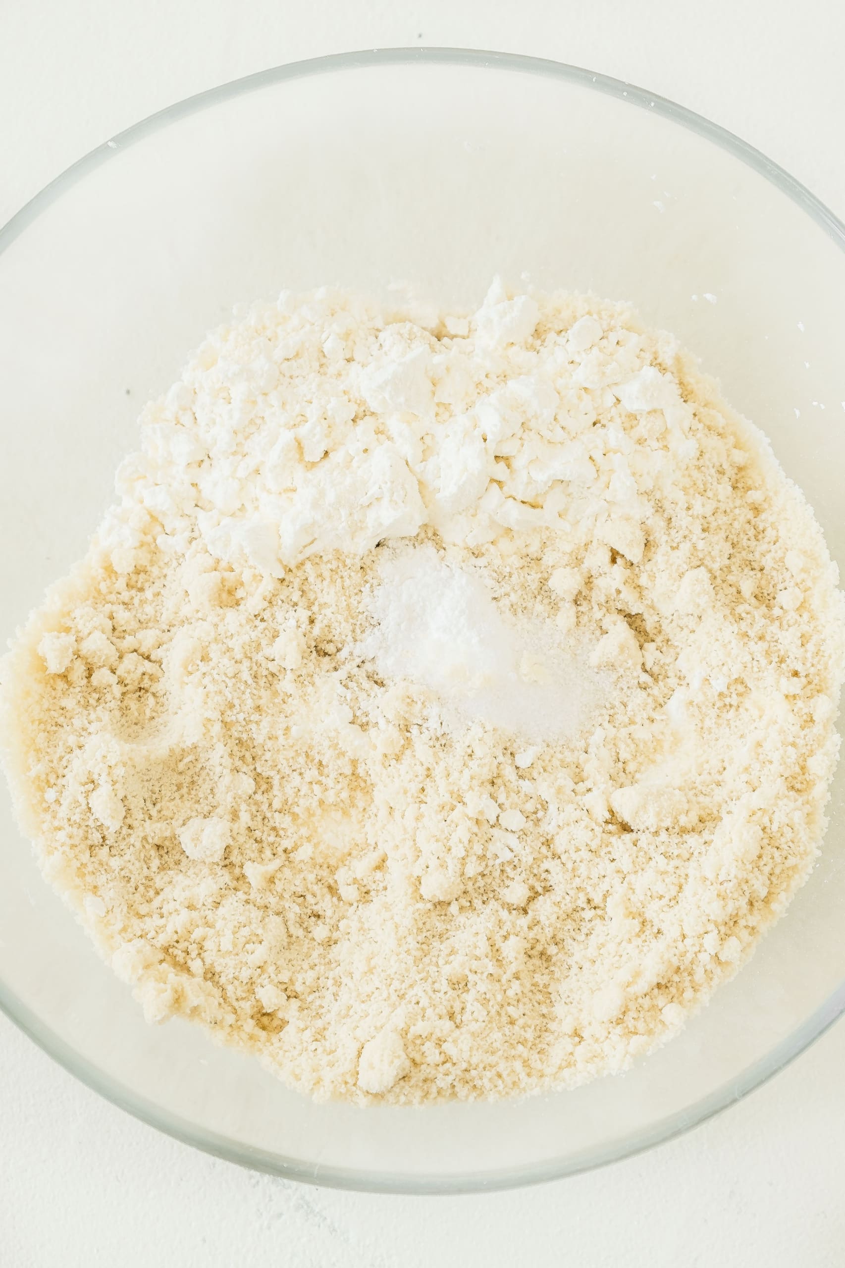 Dry ingredients in a glass mixing bowl.
