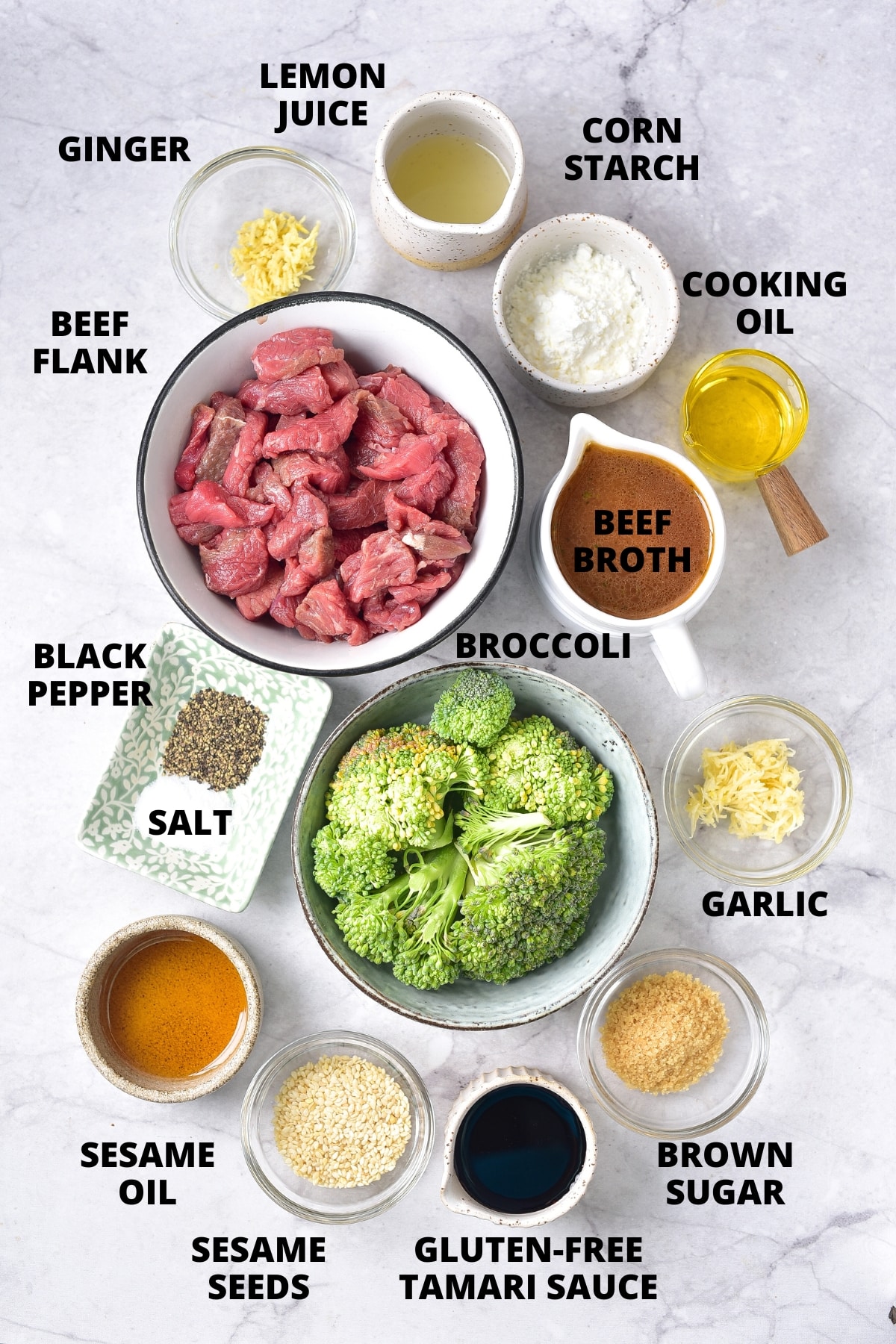 Ingredients required for gluten-free beef and broccoli recipe laid out on marble board.