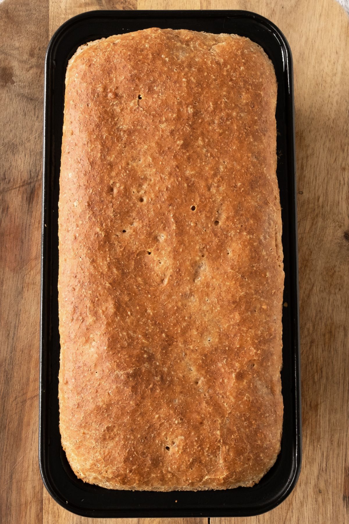 Freshly baked bread in loaf pan.