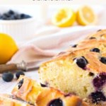 Sliced blueberry lemon bread on wooden board.