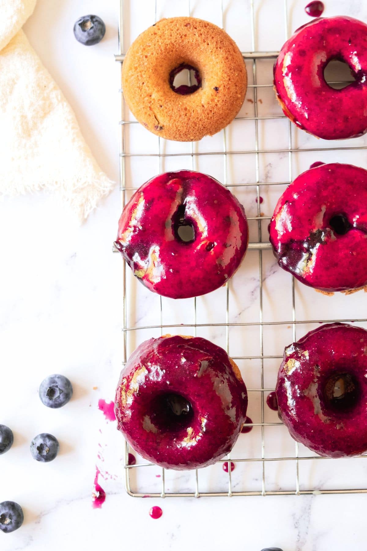 Donuts coated in blueberry donut glaze