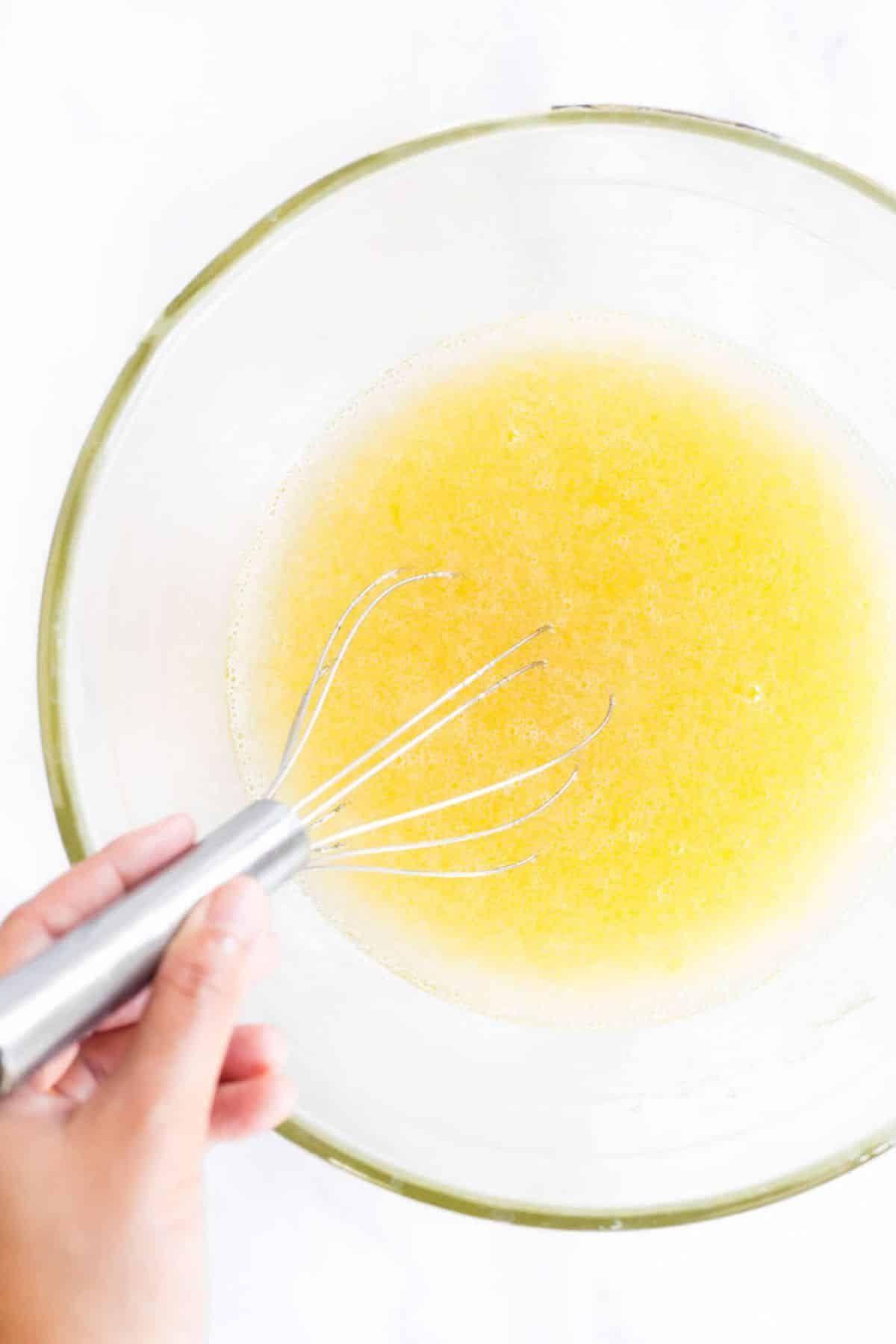 Whisk egg mixture in glass bowl